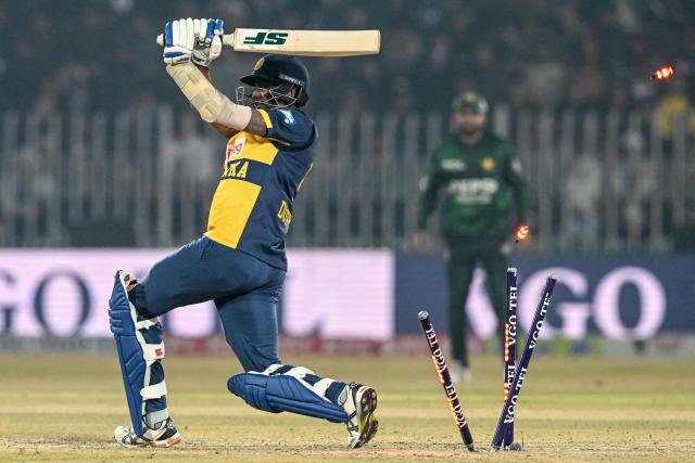Sri Lanka's Dushmantha Chameera is clean bowled by Pakistan's Salman Mirza during the Twenty20 international Tri-Series final cricket match between Pakistan and Sri Lanka at the Rawalpindi Cricket Stadium in Rawalpindi on November 29, 2025. (Photo by Aamir QURESHI / AFP)