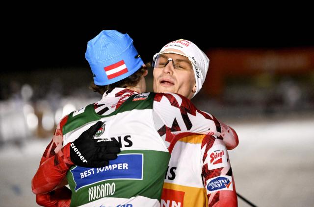 Austria's winner Johannes Lamparter of Austria (R) and third placed Thomas Rettenegger of Austria hug after the men's 10km cross-country skiing Gundersen of the Nordic Combined at the FIS World Cup Ruka Nordic in Kuusamo, Finland on November 29, 2025. (Photo by Roni Rekomaa / Lehtikuva / AFP) / Finland OUT
