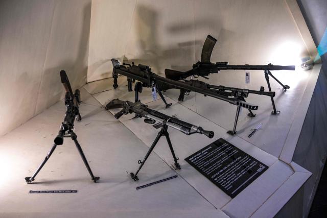 Weapons seized by Indonesia from Japan, British India and Dutch forces amid the Battle of Surabaya, which took place in November 1945 between Indonesian nationalists against British and British Indian forces for the re-imposition of Dutch colonial rule following the end of World War II, are diplayed during the 'Night at the Museum 2025' event at the 10 November Museum in Surabaya on November 29, 2025. (Photo by Juni KRISWANTO / AFP)