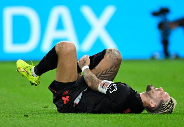 Bayer Leverkusen's German midfielder #08 Robert Andrich reacts injured on the pitch during the German first division Bundesliga football match between Bayer 04 Leverkusen and Borussia Dortmund in Leverkusen, western Germany, on November 29, 2025. (Photo by INA FASSBENDER / AFP) / DFL REGULATIONS PROHIBIT ANY USE OF PHOTOGRAPHS AS IMAGE SEQUENCES AND/OR QUASI-VIDEO