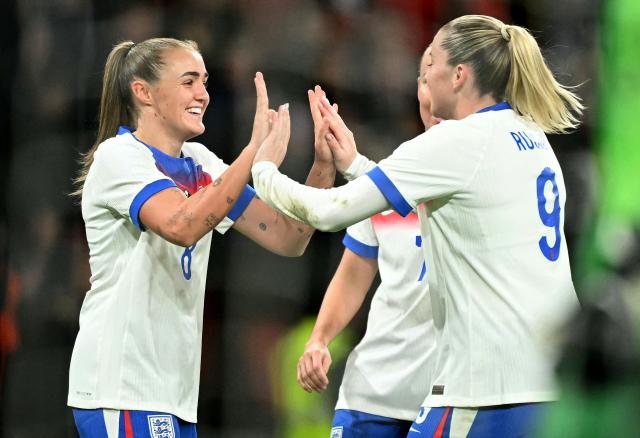 England's midfielder #08 Georgia Stanway (L) celebrates scoring the team's fourth goal with England's striker #09 Alessia Russo during the women's International football friendly match between England and China at Wembley Stadium in London on November 29, 2025. (Photo by JUSTIN TALLIS / AFP)