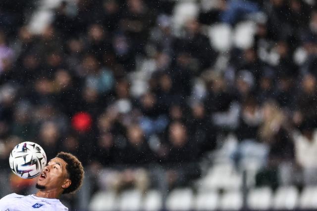 Auxerre's Cameroonian forward #19 Danny Namaso heads the ball during the French L1 football match between Paris FC and AJ Auxerre at the Stade Jean-Bouin stadium, in Paris, on November 29, 2025. (Photo by FRANCK FIFE / AFP)