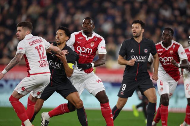 Monaco's French midfielder #08 Paul Pogba (C) runs next to Paris Saint-Germain's Brazilian defender #05 Marquinhos (2L) during the French L1 football match between AS Monaco and Paris Saint-Germain (PSG) at the Stade Louis II in the Principality of Monaco on November 29, 2025. (Photo by Valery HACHE / AFP)
