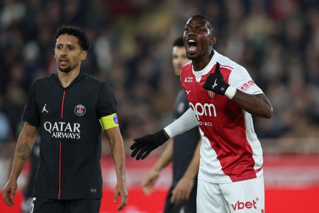 Monaco's French midfielder #08 Paul Pogba reacts next to Paris Saint-Germain's Brazilian defender #05 Marquinhos (L) during the French L1 football match between AS Monaco and Paris Saint-Germain (PSG) at the Stade Louis II in the Principality of Monaco on November 29, 2025. (Photo by Valery HACHE / AFP)