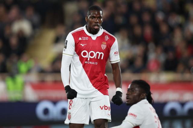 Monaco's French midfielder #08 Paul Pogba reacts next to Monaco's Ghanaian defender #22 Mohammed Salisu during the French L1 football match between AS Monaco and Paris Saint-Germain (PSG) at the Stade Louis II in the Principality of Monaco on November 29, 2025. (Photo by Valery HACHE / AFP)