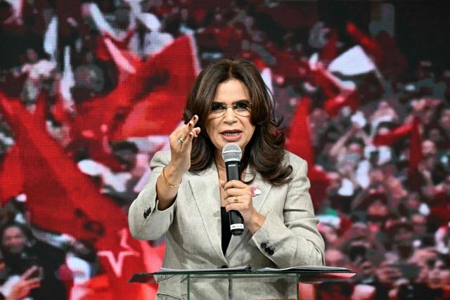 Honduran presidential candidate Rixi Moncada, of the Libertad y Refundación (LIBRE) leftist party, delivers a press conference in Tegucigalpa on Novembert 29, 2025, a day before the presidential election. There is a tight three-way race to become president of the Central American nation of Honduras on Sunday. On the left is Moncada, who rails against "the oligarchy," on the right a construction magnate and a TV host, both of whom warn of a communist menace. (Photo by Marvin RECINOS / AFP)