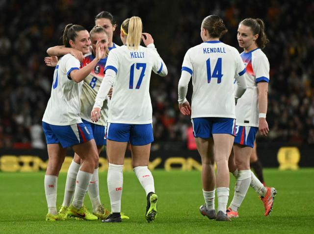 England's midfielder #10 Ella Toone (L) celebrates scoring the team's seventh goal with teammates during the women's International football friendly match between England and China at Wembley Stadium in London on November 29, 2025. (Photo by JUSTIN TALLIS / AFP)