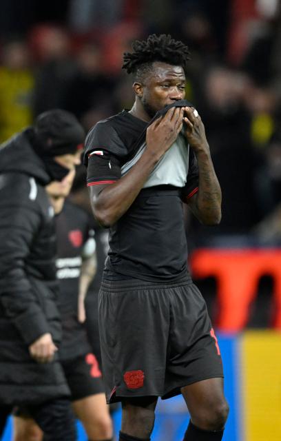 Bayer Leverkusen's Burkinabe defender #12 Edmond Tapsoba reacts after the German first division Bundesliga football match between Bayer 04 Leverkusen and Borussia Dortmund in Leverkusen, western Germany, on November 29, 2025. (Photo by INA FASSBENDER / AFP) / DFL REGULATIONS PROHIBIT ANY USE OF PHOTOGRAPHS AS IMAGE SEQUENCES AND/OR QUASI-VIDEO