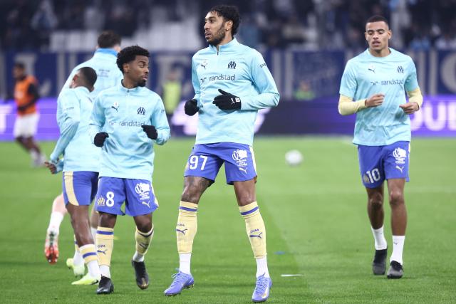 Marseille's British midfielder #08 Angel Gomes (3rd L), Marseille's Gabonese forward #97 Pierre-Emerick Aubameyang (C) and Marseille's English forward #10 Mason Greenwood (R) warm up during the French L1 football match between Olympique de Marseille (OM) and Touloue FC (TFC) at the Stade Velodrome in Marseille, southern France, on November 29, 2025. (Photo by Alex MARTIN / AFP)
