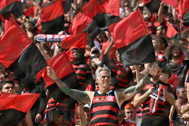 Brazil's Flamengo fans cheer before the all Brazilian Copa Libertadores final football match between Palmeiras and Flamengo at Monumental 'U' Marathon stadium in Lima on November 29, 2025. (Photo by Luis ACOSTA / AFP)