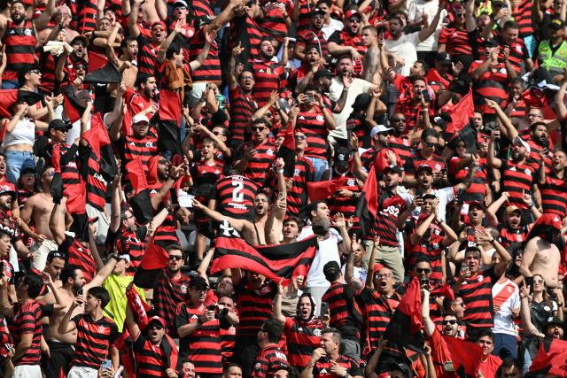 Brazil's Flamengo fans cheer before the all Brazilian Copa Libertadores final football match between Palmeiras and Flamengo at Monumental 'U' Marathon stadium in Lima on November 29, 2025. (Photo by Luis ACOSTA / AFP)