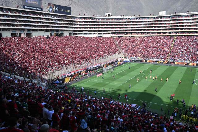 Spectators wait for the start of the all Brazilian Copa Libertadores final football match between Palmeiras and Flamengo at Monumental 'U' Marathon stadium in Lima on November 29, 2025. (Photo by Connie FRANCE / AFP)