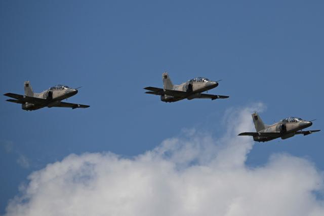 A squad of Venezuelan Air Force K8W aircraft overflies during the 2025 Venezuela industrial aviation expo at the Libertador Air Base in Maracay, Aragua State, Venezuela, on November 29, 2025. (Photo by Federico PARRA / AFP)