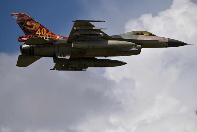 A Venezuelan air force US-made F-16 aircraft overflies during the 2025 Venezuela industrial aviation expo at the Libertador Air Base in Maracay, Aragua State, Venezuela, on November 29, 2025. (Photo by Federico PARRA / AFP)
