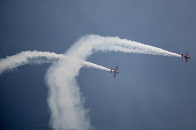 Aircrafts conduct an air show with smoke during the all Brazilian Copa Libertadores final football match between Palmeiras and Flamengo at Monumental 'U' Marathon stadium in Lima on November 29, 2025. (Photo by ERNESTO BENAVIDES / AFP)