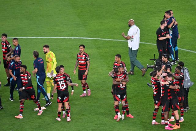 Flamengo's players celebrate after winning the all Brazilian Copa Libertadores final football match between Palmeiras and Flamengo at Monumental 'U' Marathon stadium in Lima on November 29, 2025. (Photo by Connie FRANCE / AFP)
