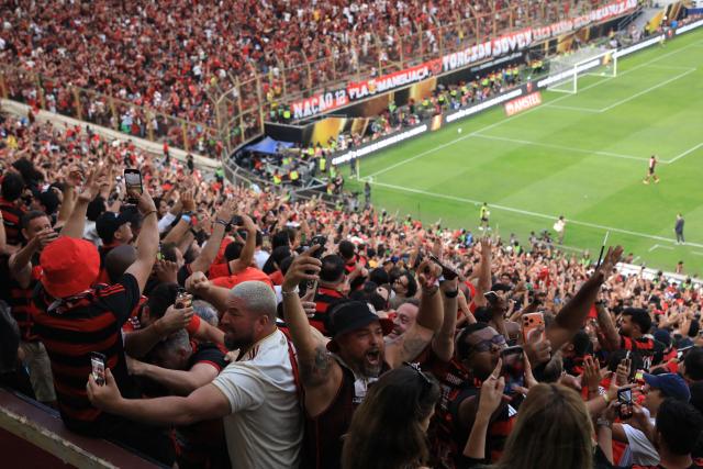 Flamengo's fans celebrate after winning the all Brazilian Copa Libertadores final football match between Palmeiras and Flamengo at Monumental 'U' Marathon stadium in Lima on November 29, 2025. (Photo by Connie FRANCE / AFP)
