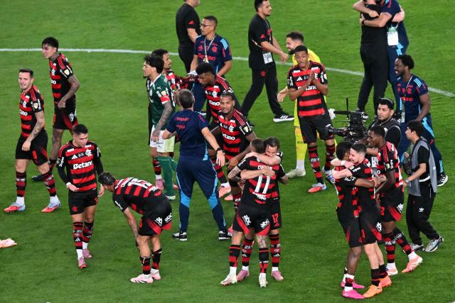 Flamengo's players celebrate after winning the all Brazilian Copa Libertadores final football match between Palmeiras and Flamengo at Monumental 'U' Marathon stadium in Lima on November 29, 2025. (Photo by Connie FRANCE / AFP)