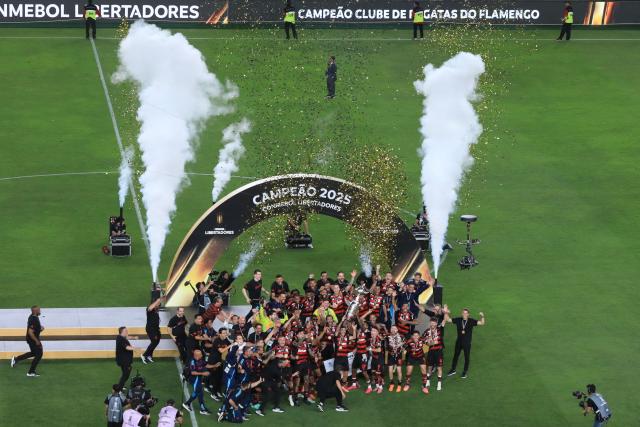 Flamengo's players lift the the trophy after winning the all Brazilian Copa Libertadores final football match between Palmeiras and Flamengo at Monumental 'U' Marathon stadium in Lima on November 29, 2025. (Photo by Connie FRANCE / AFP)