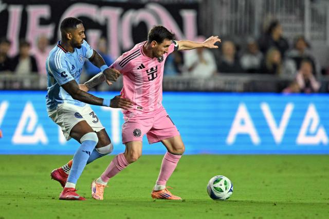 Inter Miami's Argentine forward #10 Lionel Messi (R) fights for the ball with New York City's Brazilian defender #34 Raul Gustavo (L) during the Major League Soccer (MLS) Eastern Conference final football match between Inter Miami and New York City FC at Chase Stadium in Fort Lauderdale, Florida on November 29, 2025. (Photo by CHANDAN KHANNA / AFP)