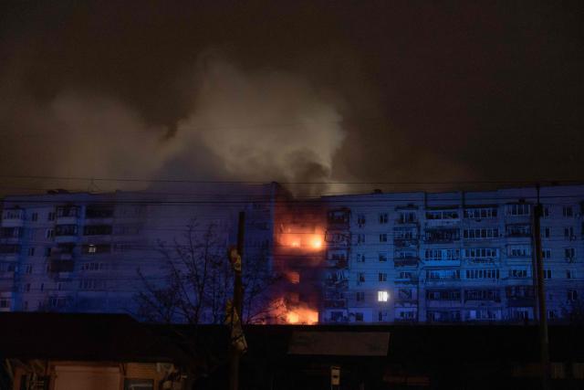 A residential building is seen on fire following a Russian drone attack on the city of Vyshhorod in the Kyiv region, early on November 30, 2025, amid the Russian invasion of Ukraine. (Photo by Roman PILIPEY / AFP)