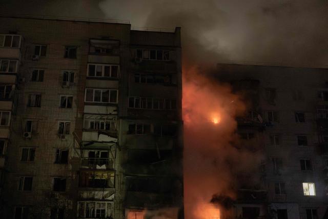 A residential building is seen on fire following a Russian drone attack on the city of Vyshhorod, in the Kyiv region early on November 30, 2025, amid the Russian invasion of Ukraine. (Photo by Roman PILIPEY / AFP)