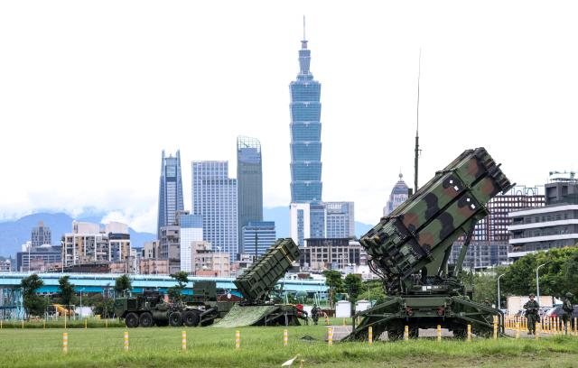 (FILES) Air Force Patriot missile systems are deployed at a local park during Taiwan's annual Han Kuang military exercise in Taipei on July 11, 2025. Taiwan's government has proposed 40 billion USD in extra defence spending over several years, with the focus on developing a multi-layered air defence system dubbed "T-Dome". (Photo by I-Hwa Cheng / AFP)