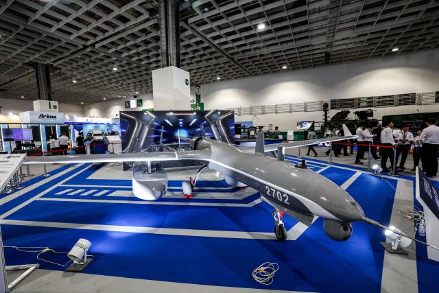 (FILES) The Rui Yuan (Sharp Hawk) unmanned aerial vehicle is displayed during the Taipei Aerospace & Defense Technology Exhibition in Taipei on September 17, 2025. Taiwan's government has proposed 40 billion USD in extra defence spending over several years, with the focus on developing a multi-layered air defence system dubbed "T-Dome". (Photo by I-Hwa Cheng / AFP)
