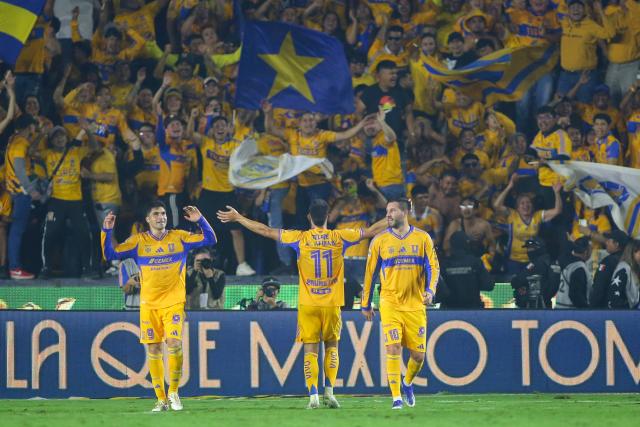 Tigres' Argentine midfielder #11 Juan Brunetta celebrates scoring his team's third goal during the Liga MX Apertura quarter-final second leg football match between Tigres and Tijuana at the UANL University Stadium in San Nicolas de los Garza, Nuevo Leon State, Mexico on November 29, 2025. (Photo by Julio Cesar AGUILAR / AFP)