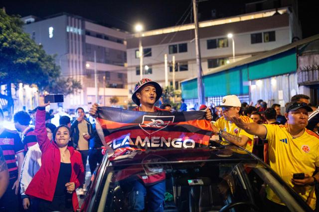 Flamengo's fans celebrate after winning the all Brazilian Copa Libertadores final football match between Palmeiras and Flamengo in the Miraflores District in Lima on November 29, 2025. (Photo by Renato PAJUELO / AFP)