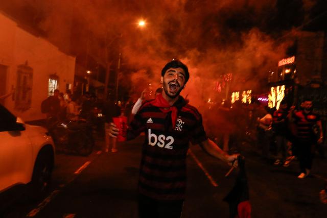 Flamengo's fans celebrate after winning the all Brazilian Copa Libertadores final football match between Palmeiras and Flamengo in the Miraflores District in Lima on November 29, 2025. (Photo by Renato PAJUELO / AFP)