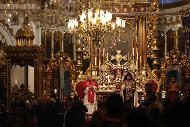 Pope Leo XIV is welcomed by Patriarch Sahak II during a visit to the Armenian Apostolic Cathedral, in Istanbul on November 30, 2025. (Photo by BERK OZKAN / AFP)