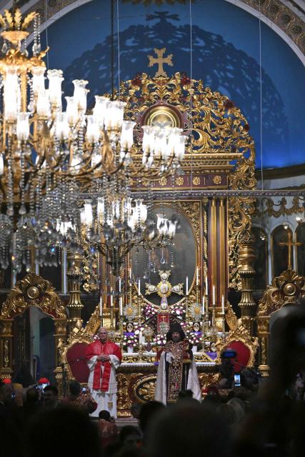 Pope Leo XIV stands next to Patriarch Sahak II during a visit to the Armenian Apostolic Cathedral, in Istanbul on November 30, 2025. (Photo by Andreas SOLARO / AFP)