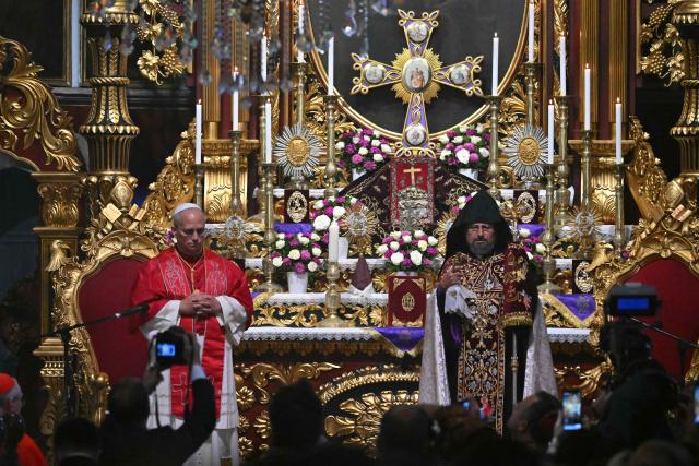 Pope Leo XIV is welcomed by Patriarch Sahak II during a visit to the Armenian Apostolic Cathedral, in Istanbul on November 30, 2025. (Photo by Andreas SOLARO / AFP)
