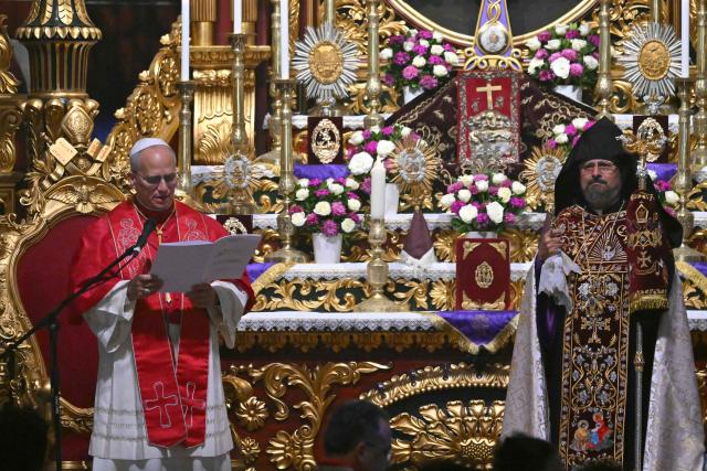 TOPSHOT - Pope Leo XIV speaks next to Patriarch Sahak II during a visit to the Armenian Apostolic Cathedral, in Istanbul on November 30, 2025. (Photo by Andreas SOLARO / AFP)