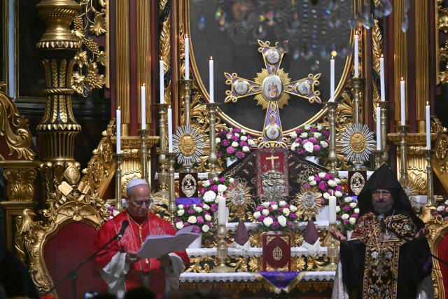 Pope Leo XIV speaks next to Patriarch Sahak II during a visit to the Armenian Apostolic Cathedral, in Istanbul on November 30, 2025. (Photo by Andreas SOLARO / AFP)
