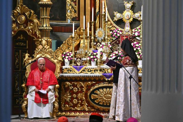 Pope Leo XIV listens to Patriarch Sahak II during a visit to the Armenian Apostolic Cathedral, in Istanbul on November 30, 2025. (Photo by Andreas SOLARO / AFP)