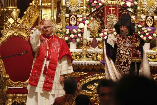 Pope Leo XIV stands next to Patriarch Sahak II during a visit to the Armenian Apostolic Cathedral, in Istanbul on November 30, 2025. (Photo by BERK OZKAN / AFP)
