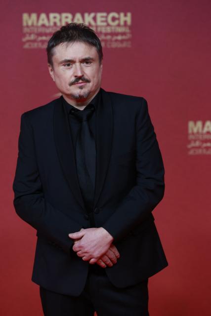 Romanian filmmaker Cristian Mungiu, poses on the red carpet on the second day of the 22nd edition of the Marrakech International Film Festival in Morocco, on November 29, 2025. (Photo by Abdel Majid BZIOUAT / AFP)