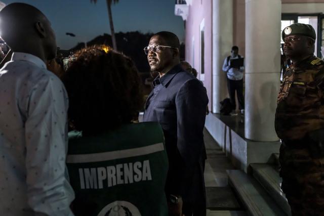 Ilidio Vieira Te, the newly appointed Prime Minister and Finance Minister of the transitional government, speaks to the media at the end of the swearing-in ceremony of the newly formed government at the Presidential Palace in Bissau on November 29, 2025. Guinea-Bissau's junta formed a government on Saturday days after taking power in a coup, as ousted president Umaro Sissoco Embalo arrived in the Republic of Congo's capital Brazzaville. The military took control of the Portuguese-speaking nation on Wednesday -- a day before the provisional results of national elections were due to be announced -- and Embalo had initially left for neighbouring Senegal.
On Saturday the junta tapped 28 people, including five army officers and four women, to lead the drug-trafficking hotspot. (Photo by PATRICK MEINHARDT / AFP)