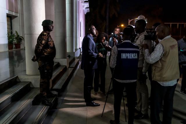 Ilidio Vieira Te, the newly appointed Prime Minister and Finance Minister of the transitional government, speaks to the media at the end of the swearing-in ceremony of the newly formed government at the Presidential Palace in Bissau on November 29, 2025. Guinea-Bissau's junta formed a government on Saturday days after taking power in a coup, as ousted president Umaro Sissoco Embalo arrived in the Republic of Congo's capital Brazzaville. The military took control of the Portuguese-speaking nation on Wednesday -- a day before the provisional results of national elections were due to be announced -- and Embalo had initially left for neighbouring Senegal.
On Saturday the junta tapped 28 people, including five army officers and four women, to lead the drug-trafficking hotspot. (Photo by PATRICK MEINHARDT / AFP)