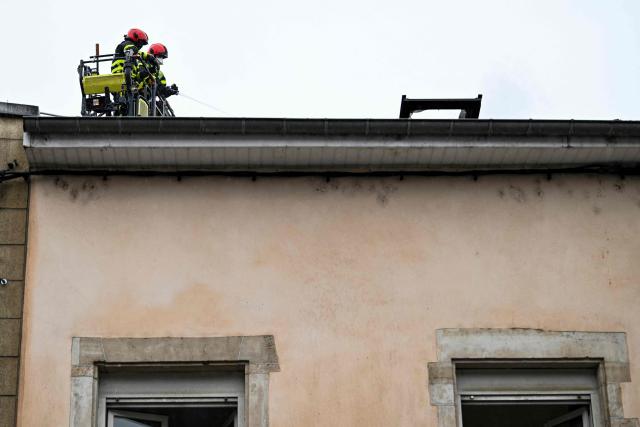 Firefighters intervene on a site where at least five people died following a fire, in Neuves-Maisons, eastern France, on November 30, 2025. A 59-year-old man, a 60-year-old woman, a 20-year-old woman and a 16-year-old boy died, the fire brigade announced. A fifth person, who had been seriously injured, succumbed to their injuries, the prefecture said shortly afterwards. (Photo by Jean-Christophe VERHAEGEN / AFP)