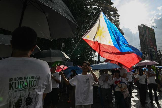 Protesters take part in an anti-corruption rally along Epifanio de los Santos Avenue, or EDSA, in Quezon City, Metro Manila on November 30, 2025. Thousands massed in the Philippine capital on November 30 demanding accountability over a multi-billion-dollar infrastructure scandal that has seen scores of officials, lawmakers and construction firm owners accused of corruption. (Photo by Jam STA ROSA / AFP)