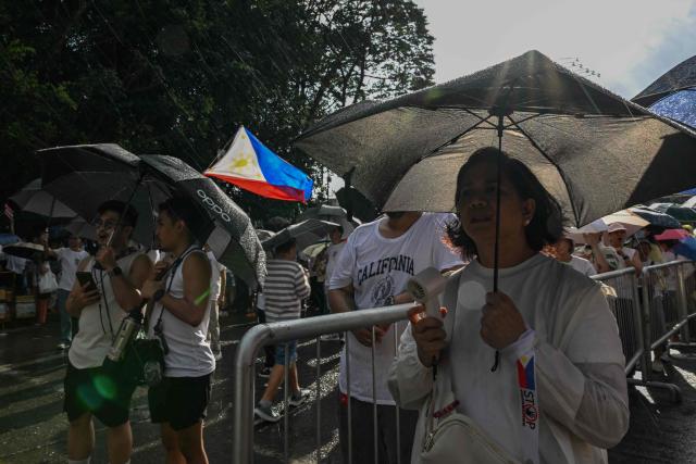 Protesters take part in an anti-corruption rally along Epifanio de los Santos Avenue, or EDSA, in Quezon City, Metro Manila on November 30, 2025. Thousands massed in the Philippine capital on November 30 demanding accountability over a multi-billion-dollar infrastructure scandal that has seen scores of officials, lawmakers and construction firm owners accused of corruption. (Photo by Jam STA ROSA / AFP)