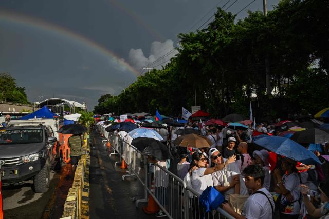 Protesters take part in an anti-corruption rally along Epifanio de los Santos Avenue, or EDSA, in Quezon City, Metro Manila on November 30, 2025. Thousands massed in the Philippine capital on November 30 demanding accountability over a multi-billion-dollar infrastructure scandal that has seen scores of officials, lawmakers and construction firm owners accused of corruption. (Photo by Jam STA ROSA / AFP)