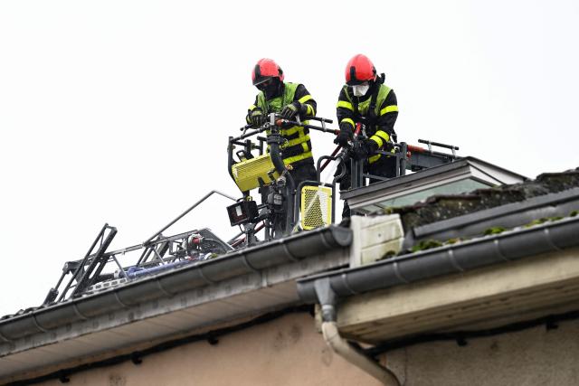 Firefighters intervene on a site where at least five people died following a fire, in Neuves-Maisons, eastern France, on November 30, 2025. A 59-year-old man, a 60-year-old woman, a 20-year-old woman and a 16-year-old boy died, the fire brigade announced. A fifth person, who had been seriously injured, succumbed to their injuries, the prefecture said shortly afterwards. (Photo by Jean-Christophe VERHAEGEN / AFP)