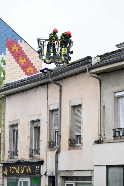 Firefighters intervene on a site where at least five people died following a fire, in Neuves-Maisons, eastern France, on November 30, 2025. A 59-year-old man, a 60-year-old woman, a 20-year-old woman and a 16-year-old boy died, the fire brigade announced. A fifth person, who had been seriously injured, succumbed to their injuries, the prefecture said shortly afterwards. (Photo by Jean-Christophe VERHAEGEN / AFP)