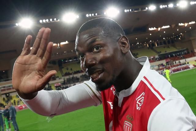 Monaco's French midfielder #08 Paul Pogba waves to supporters at the end of the French L1 football match between AS Monaco and Paris Saint-Germain (PSG) at the Stade Louis II in the Principality of Monaco on November 29, 2025. (Photo by Valery HACHE / AFP)