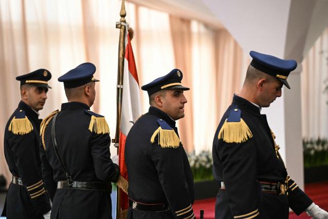 The Guard of Honor stands by as they wait for the arrival of Pope Leo XIV at Beirut International Airport on November 30, 2025. On his first overseas trip since being elected leader of the worldís 1.4 billion Catholics, Leo has arrived in Lebanon on November 30, with a message of peace for the crisis-mired nation. (Photo by Jewel SAMAD / AFP)