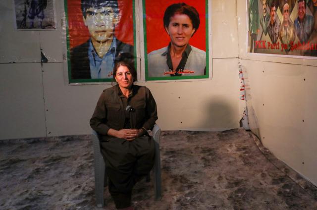 Sherda Mazlum Gabar, a senior commander of the Kurdistan Workers' Party (PKK), speaks during an interview with AFP in a cave network located in the Qandil Mountains, part of the Zagros mountain range, near the Iraqi-Iranian-Turkish borders on November 29, 2025. Fellow senior Kurdistan Workers' Party commander Amed Malazgirt  told AFP the PKK will take no further steps in the ongoing peace process with Turkey, urging Ankara to advance negotiations and release its founder Abdullah Ocalan. "All the steps the leader Apo has initiated have been implemented... there will be no further actions taken," commander Malazgirt told AFP on November 29, 2025, in a bunker in the Qandil Mountains in northern Iraq. (Photo by Safin HAMID / AFP)
